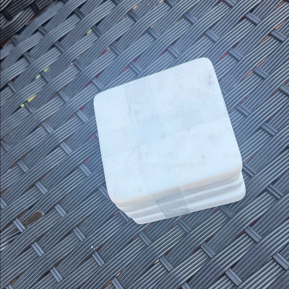 Stack of White Square Marble Coasters